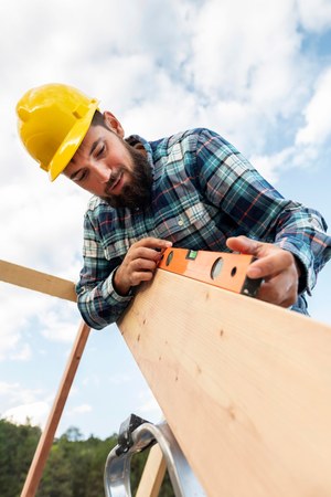 Roofer repairing a rooftop